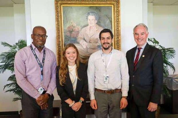 Liz Heintz in a group photo with Drs. Robert Newton Jr., Terrence Riley, and John Kirwan at Pennington Biomedical Research Center.